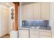 A beautifully tiled wet bar with wooden pillar support at 10801 E Happy Valley Rd # 102, Scottsdale, AZ 85255