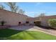 Fire pit area with built in seating in the backyard at 10813 W Saddlehorn Rd, Peoria, AZ 85383