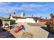 Backyard view of home with playset and gravel at 10837 S Shoshoni Dr, Phoenix, AZ 85044