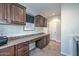 Functional laundry room with plenty of counter space, storage cabinets, and a utility sink for added convenience at 12780 W Desert Vista Trl, Peoria, AZ 85383