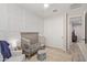 Bright Bedroom with crib, seating, and built-in shelving at 1712 W Dawn Dr, Tempe, AZ 85284