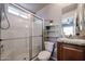 Clean bathroom with a walk-in shower, updated vanity, and tiled floors at 17200 W Bell Rd # 873, Surprise, AZ 85374