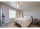 Spacious bedroom with ceiling fan, large window, and tiled floors at 17200 W Bell Rd # 873, Surprise, AZ 85374