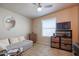 Versatile bedroom with a sofa, ceiling fan, and built in shelving at 17200 W Bell Rd # 873, Surprise, AZ 85374