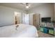 Bright bedroom with ceiling fan, tiled floors, and a large closet at 17200 W Bell Rd # 873, Surprise, AZ 85374