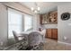 Kitchen dining area with table and chairs, built-in cabinets at 17200 W Bell Rd # 873, Surprise, AZ 85374