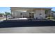 Tan mobile home with covered patio and parking area at 17200 W Bell Rd # 873, Surprise, AZ 85374