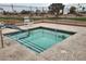Relaxing hot tub with easy access steps and nearby seating at 17200 W Bell Rd # 873, Surprise, AZ 85374