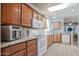 White appliances and light wood cabinets in kitchen at 17200 W Bell Rd # 873, Surprise, AZ 85374