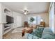 Spacious living room with tiled floors and a ceiling fan at 17200 W Bell Rd # 873, Surprise, AZ 85374