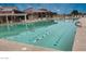 Large swimming pool with lane markers and comfortable lounging area at 17200 W Bell Rd # 873, Surprise, AZ 85374