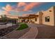 Sprawling backyard with pool, outdoor seating area, and manicured turf and desert landscaping at 19721 W Pierson St, Litchfield Park, AZ 85340