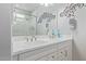 Double vanity bathroom with a large mirror and modern fixtures at 2038 E Dry Wood Rd, Phoenix, AZ 85024
