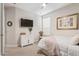 Cozy bedroom with a TV and comfortable bedding at 2038 E Dry Wood Rd, Phoenix, AZ 85024