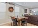 Kitchen dining area with wooden table and black chairs at 2038 E Dry Wood Rd, Phoenix, AZ 85024