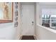 Bright entryway with white door and wood-look floors at 2038 E Dry Wood Rd, Phoenix, AZ 85024