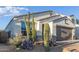 New construction home with desert landscaping and a two-car garage at 2038 E Dry Wood Rd, Phoenix, AZ 85024
