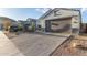 Modern home with a two-car garage and desert landscaping at 2038 E Dry Wood Rd, Phoenix, AZ 85024