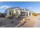 Modern home with a clean design and a large front yard with desert landscaping at 2038 E Dry Wood Rd, Phoenix, AZ 85024