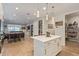 Open concept kitchen with island, pantry, and view of living area at 2038 E Dry Wood Rd, Phoenix, AZ 85024