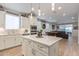 Open concept kitchen with large island and view of living room at 2038 E Dry Wood Rd, Phoenix, AZ 85024