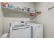 Laundry room with washer, dryer and shelving at 2038 E Dry Wood Rd, Phoenix, AZ 85024