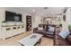 Open living room with leather sofas and a view into the kitchen at 2038 E Dry Wood Rd, Phoenix, AZ 85024