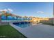 Inviting backyard pool with tropical-themed wall at 2038 E Dry Wood Rd, Phoenix, AZ 85024