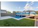 Tropical-themed pool and patio with artificial turf at 2038 E Dry Wood Rd, Phoenix, AZ 85024