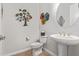 Stylish powder room with pedestal sink and decorative accents at 2038 E Dry Wood Rd, Phoenix, AZ 85024