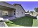 Spacious backyard with grassy area, covered patio and block wall at 2234 E 37Th Ave, Apache Junction, AZ 85119