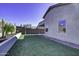 Landscaped backyard with grassy lawn, block wall, and desert plants at 2234 E 37Th Ave, Apache Junction, AZ 85119