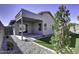 Private backyard with covered patio, grassy lawn, and rock garden at 2234 E 37Th Ave, Apache Junction, AZ 85119