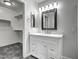 Modern bathroom with white vanity, mirror and walk-in closet at 2234 E 37Th Ave, Apache Junction, AZ 85119