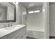 Clean bathroom featuring a white vanity, shower/tub, and mirror at 2234 E 37Th Ave, Apache Junction, AZ 85119