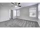 Primary bedroom with ceiling fan and ensuite bathroom at 2234 E 37Th Ave, Apache Junction, AZ 85119