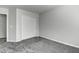 Bedroom with grey carpet, double door closet, and neutral walls at 2234 E 37Th Ave, Apache Junction, AZ 85119
