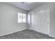 Simple bedroom with carpet, window, and closet with sliding doors at 2234 E 37Th Ave, Apache Junction, AZ 85119