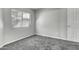 Bright bedroom with grey carpet and large window at 2234 E 37Th Ave, Apache Junction, AZ 85119