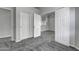Bedroom with grey carpet, double doors, and access to bath at 2234 E 37Th Ave, Apache Junction, AZ 85119