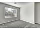 Spacious bedroom with window, carpet, and neutral walls at 2234 E 37Th Ave, Apache Junction, AZ 85119