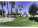 Community park with playground, covered picnic areas, and mature palm trees at 2234 E 37Th Ave, Apache Junction, AZ 85119
