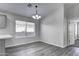 Bright dining room with wood-look floors and a chandelier at 2234 E 37Th Ave, Apache Junction, AZ 85119