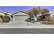 Single-story house featuring a two-car garage and a paved driveway at 2234 E 37Th Ave, Apache Junction, AZ 85119