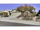 One-story home with a two-car garage and desert landscaping at 2234 E 37Th Ave, Apache Junction, AZ 85119