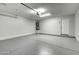 Garage with open door, epoxy floor, and water heater at 2234 E 37Th Ave, Apache Junction, AZ 85119