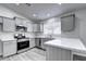 Updated kitchen featuring gray cabinets and stainless steel appliances at 2234 E 37Th Ave, Apache Junction, AZ 85119