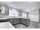 Modern kitchen with gray cabinets, island, and white countertops at 2234 E 37Th Ave, Apache Junction, AZ 85119
