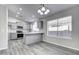 Modern kitchen with gray cabinets, island, and stainless steel appliances at 2234 E 37Th Ave, Apache Junction, AZ 85119