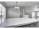 Modern kitchen features a large quartz island and updated lighting at 2234 E 37Th Ave, Apache Junction, AZ 85119
